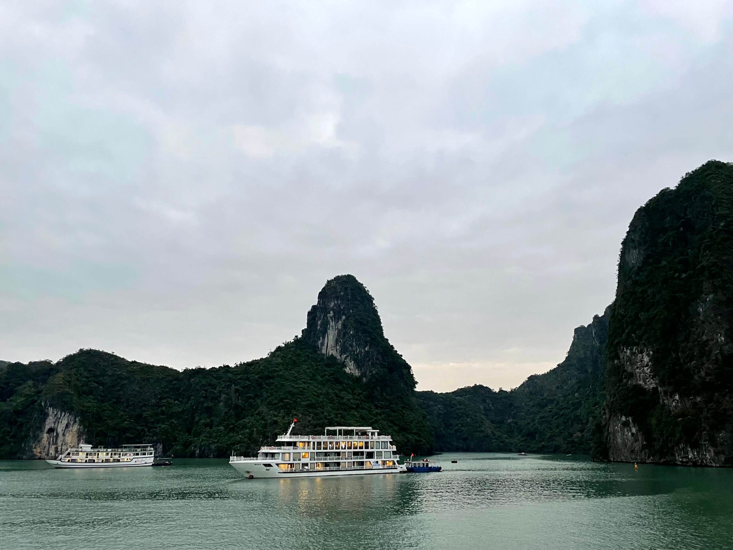 Cruise ships in front of the limestone karsts in Halong Bay